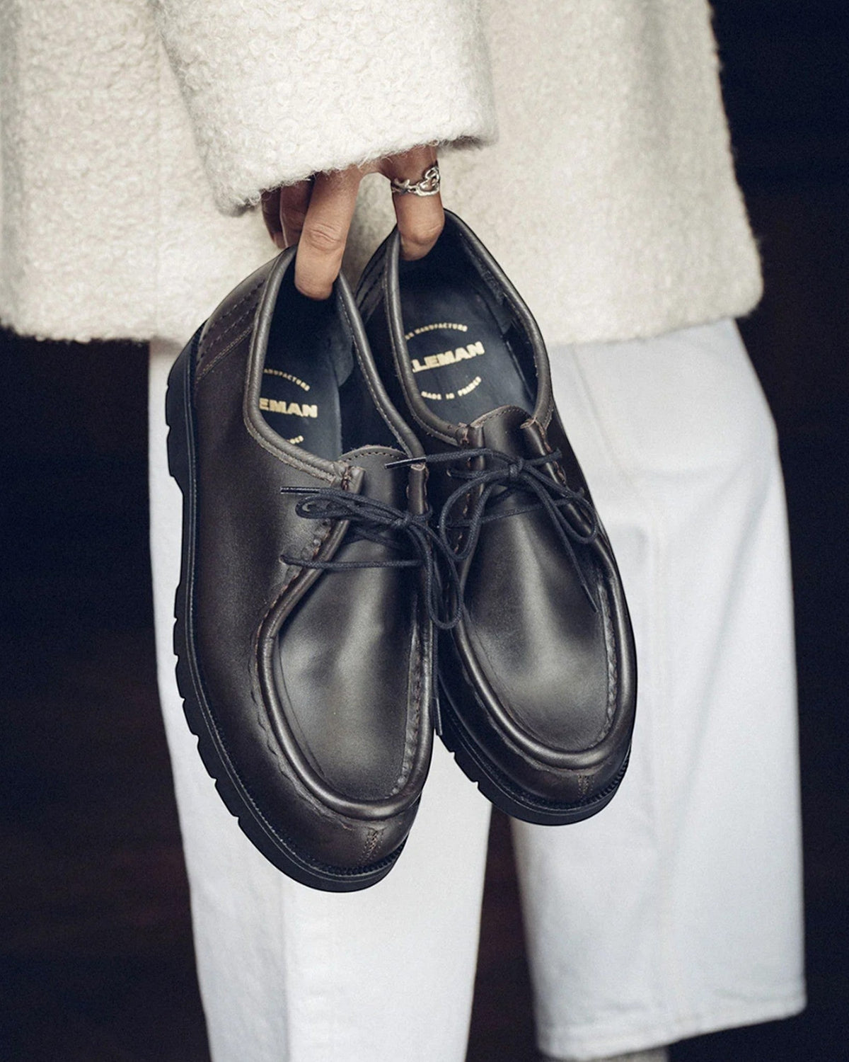 Lockwood Avenue Kleman Padror brown leather derby shoes with apron toe and chunky black rubber lug sole held by hand