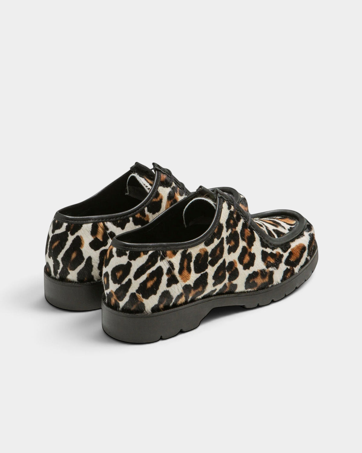 Lockwood Avenue Kleman Padror derby shoes in panther print cowhide leather with a chunky black rubber lug sole.