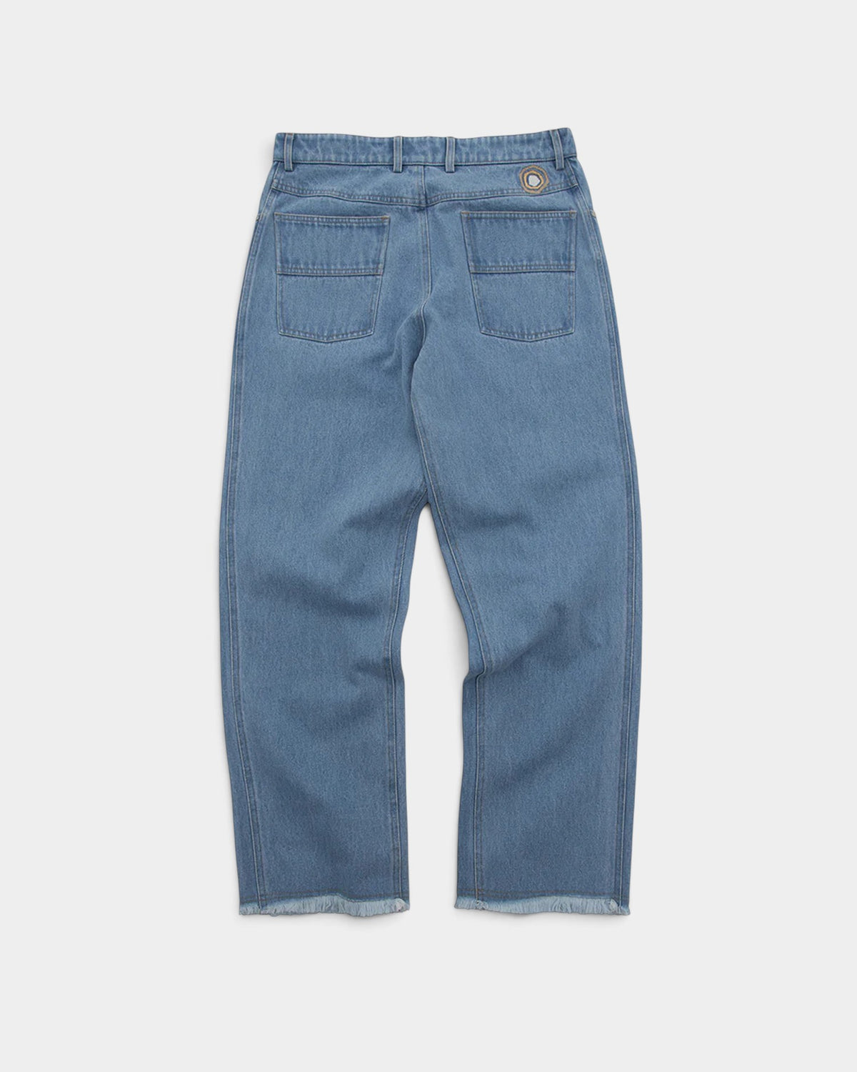 Lockwood Avenue Magic Castles blue denim jeans with back pockets, vertical seams, and a raw-cut hem.