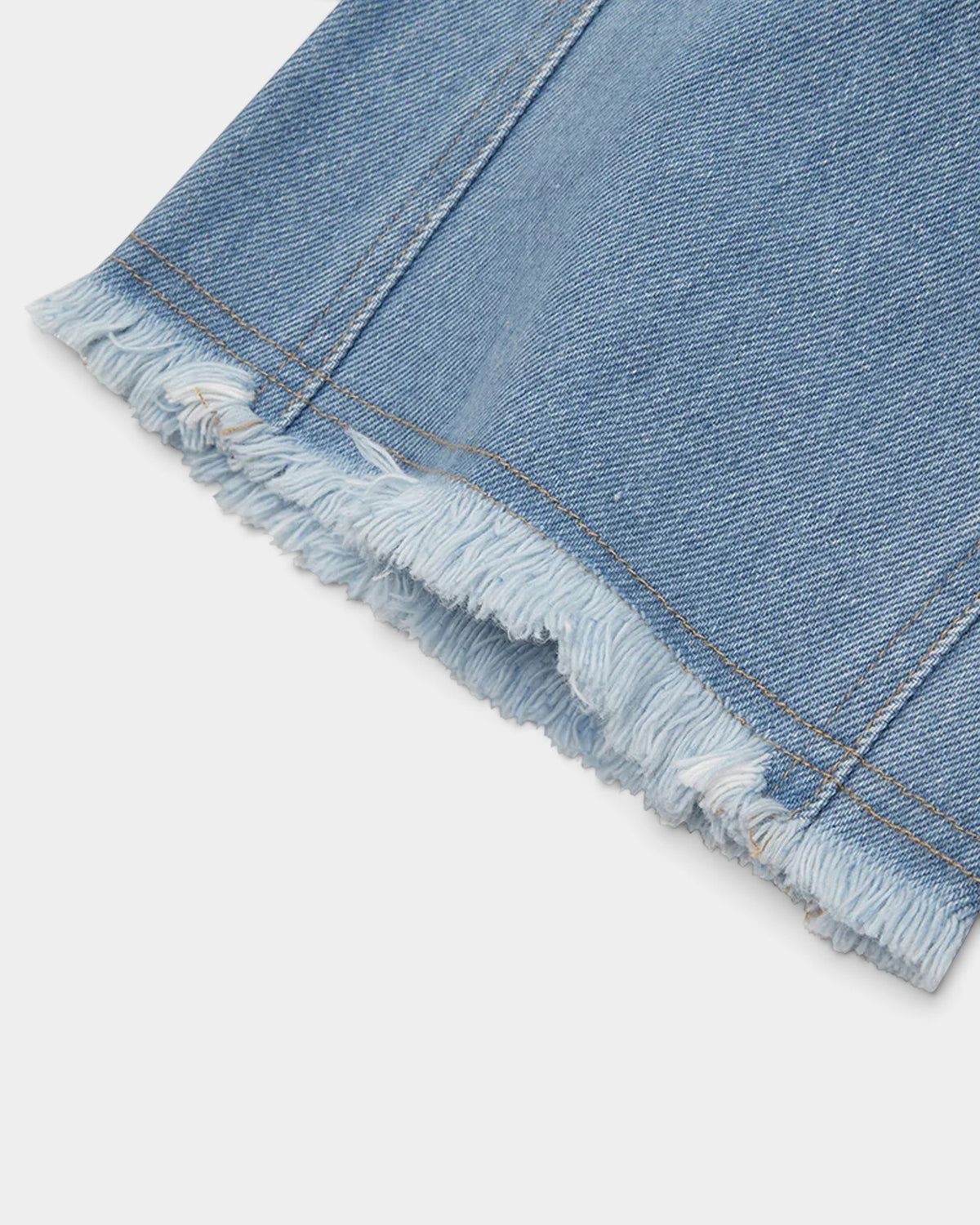 Lockwood Avenue Magic Castles Trip Jean featuring light blue denim with vertical seams and a raw-cut frayed hem.