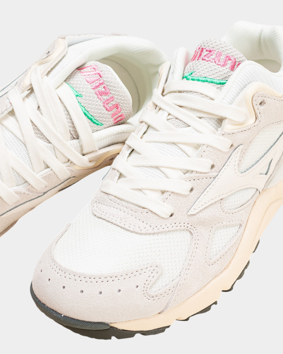 Lockwood Avenue Mizuno Sky Medal sneakers in off-white mesh, nylon, and leather with pink and green tongue branding.