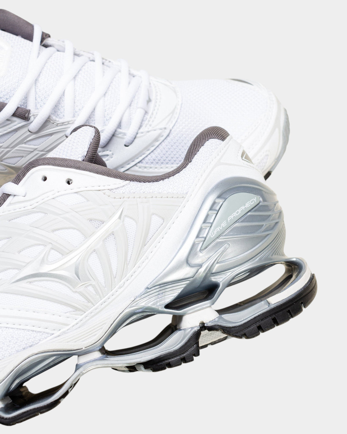 Lockwood Avenue Mizuno Wave Prophecy LS sneakers in white, silver, and harbor mist with exposed Infinity Wave sole.