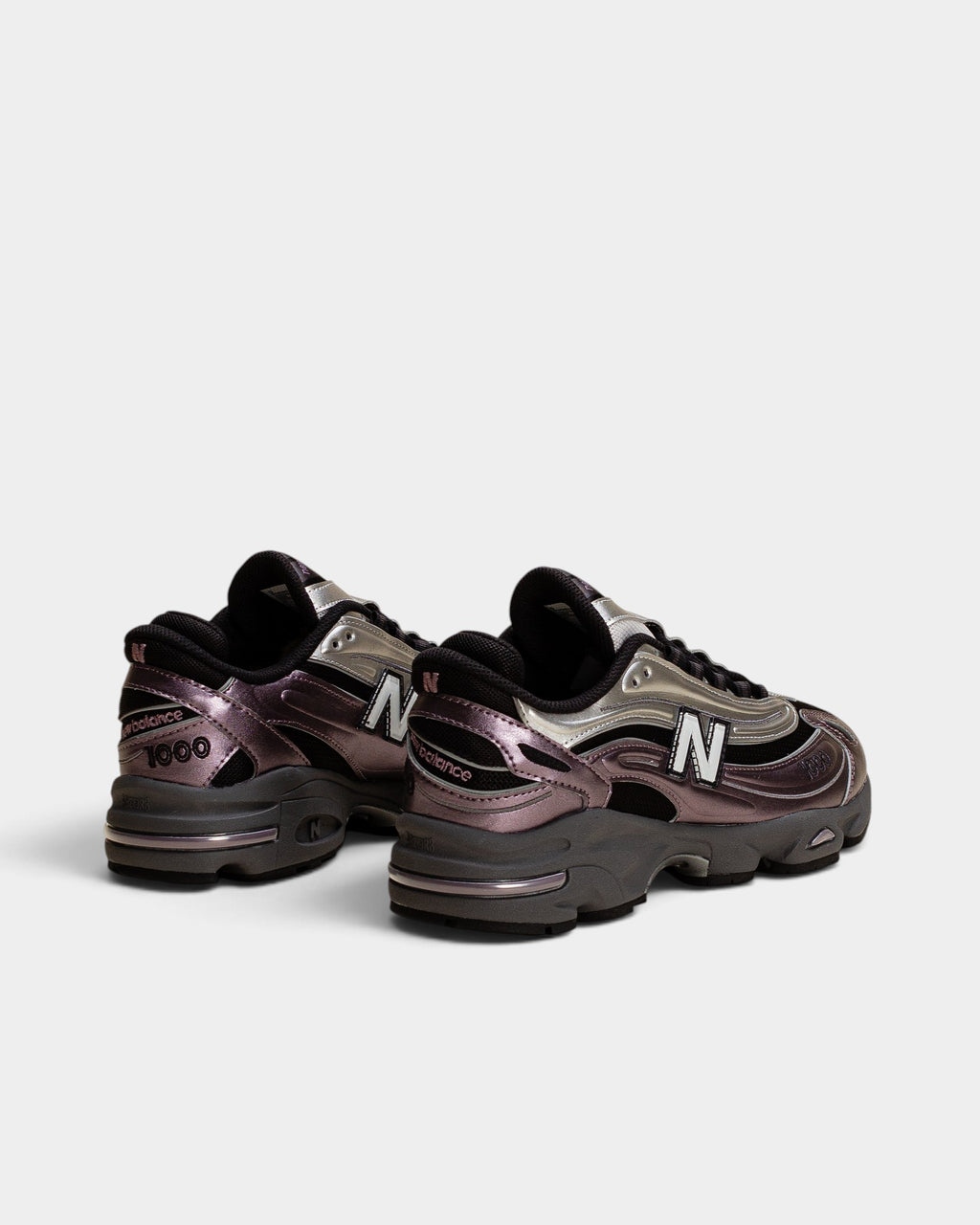 Lockwood Avenue New Balance 1000 sneakers in dark ice wine and metallic silver with mesh and suede detailing.