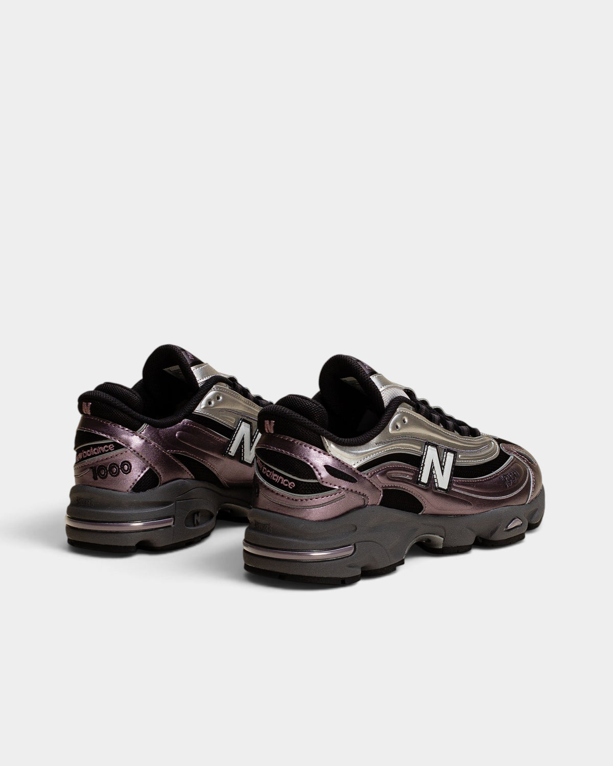 Lockwood Avenue New Balance 1000 sneakers in dark ice wine and metallic silver with mesh and suede detailing.