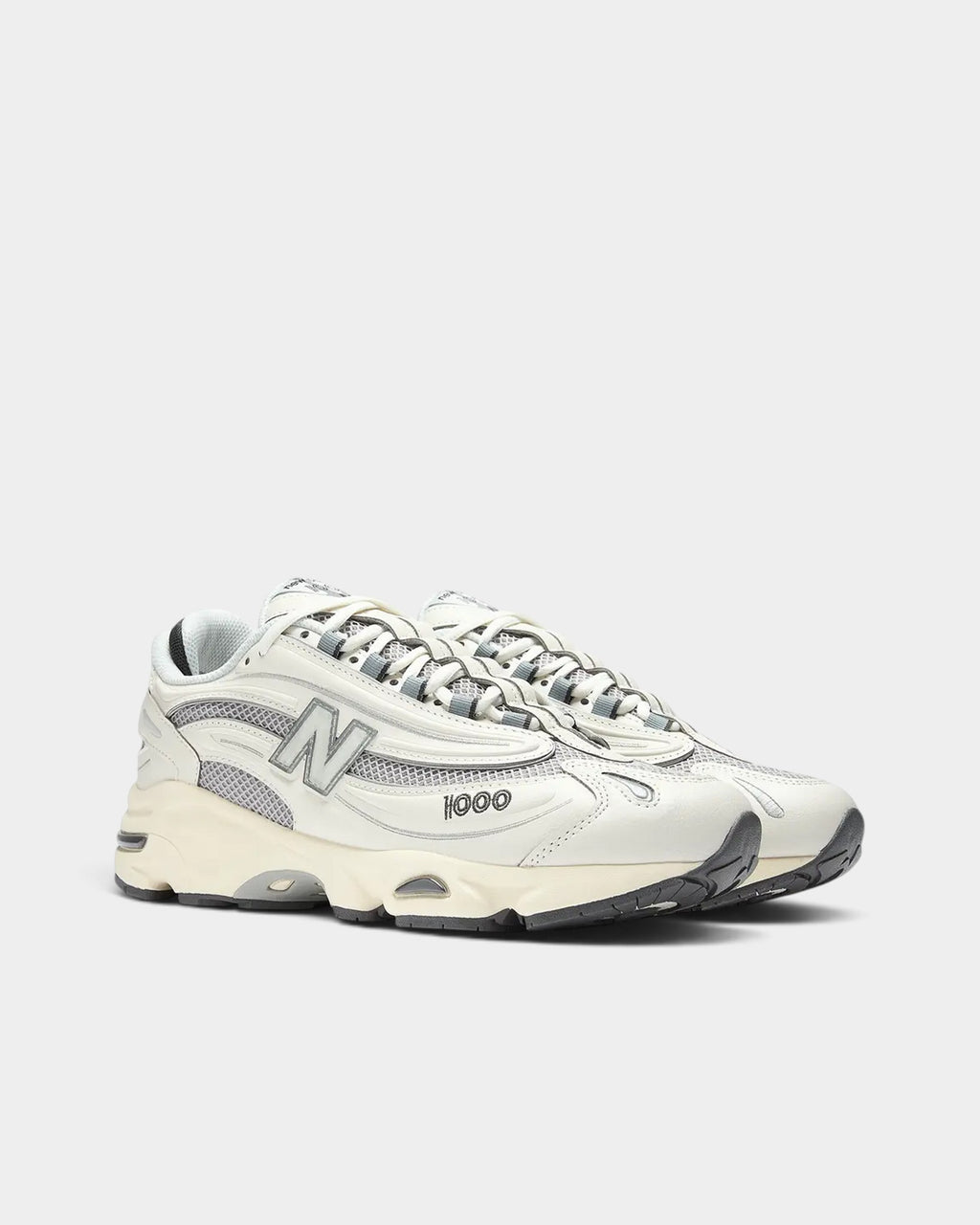 Lockwood Avenue New Balance 1000 sneakers in sea salt white leather and mesh with an aged-look midsole.