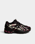 Lockwood Avenue New Balance 1906A running shoes in black with dragon berry pink accents and glow-in-the-dark details.