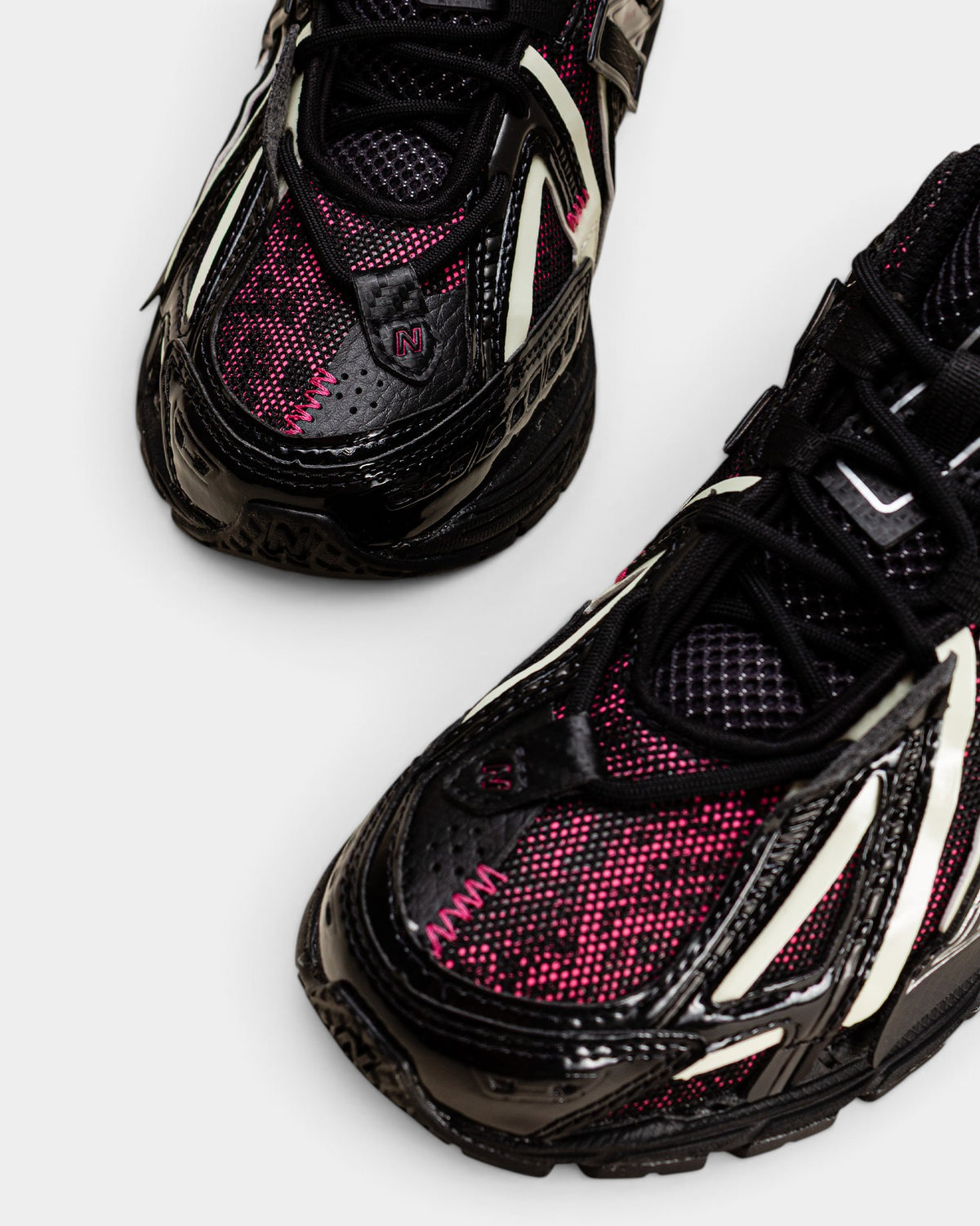 Lockwood Avenue New Balance 1906A sneakers in black and dragon berry pink with open-mesh and glow-in-the-dark accents
