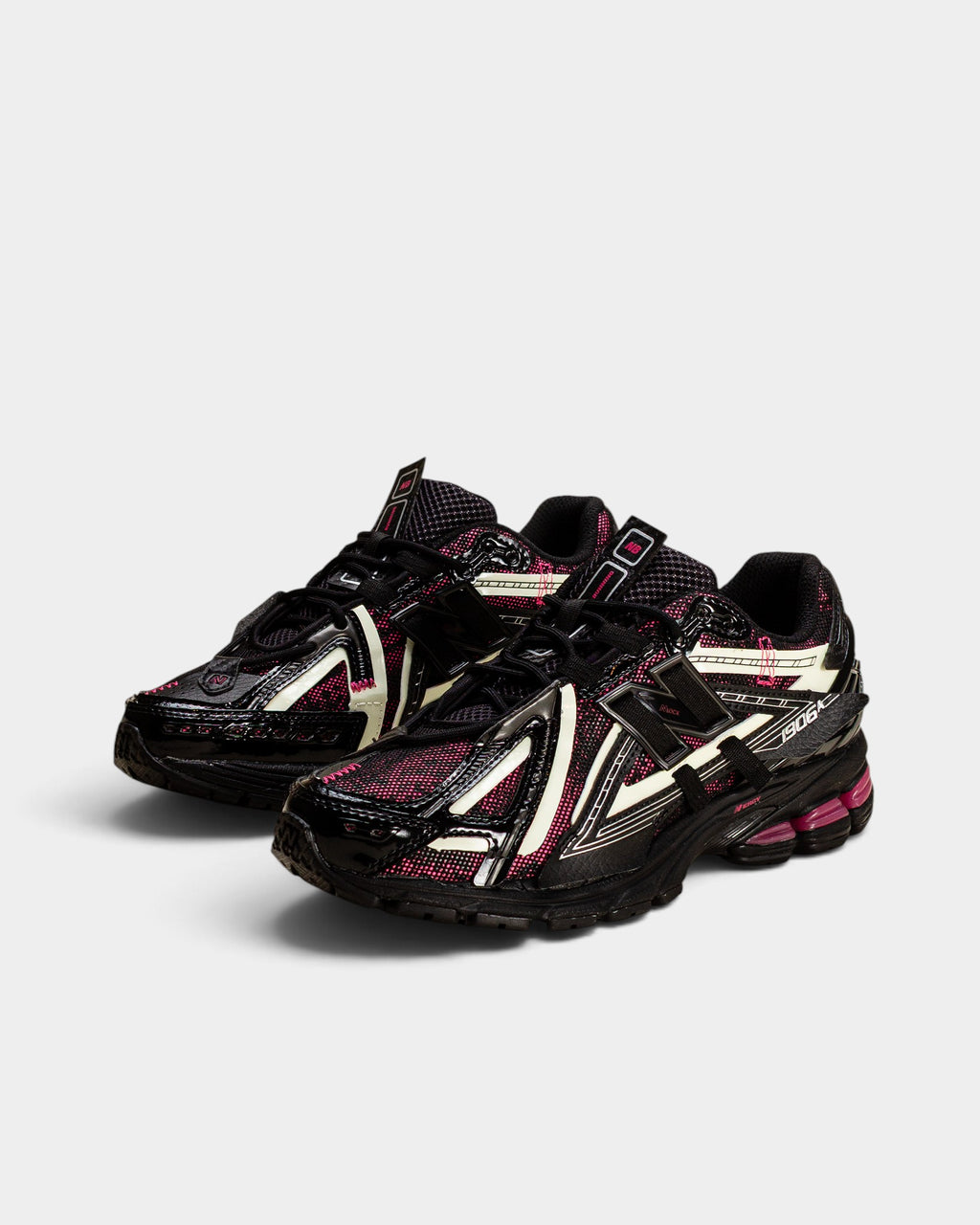 Lockwood Avenue New Balance 1906A sneakers in black with dragon berry pink and white glow-in-the-dark accents.