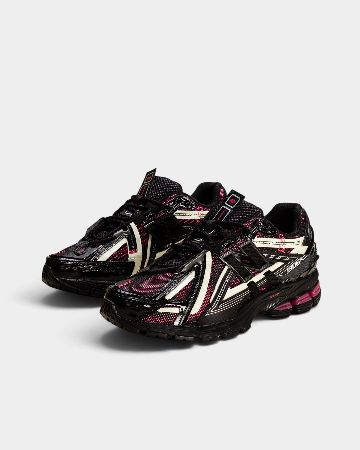 Lockwood Avenue New Balance 1906A sneakers in black with dragon berry pink and white glow-in-the-dark accents.