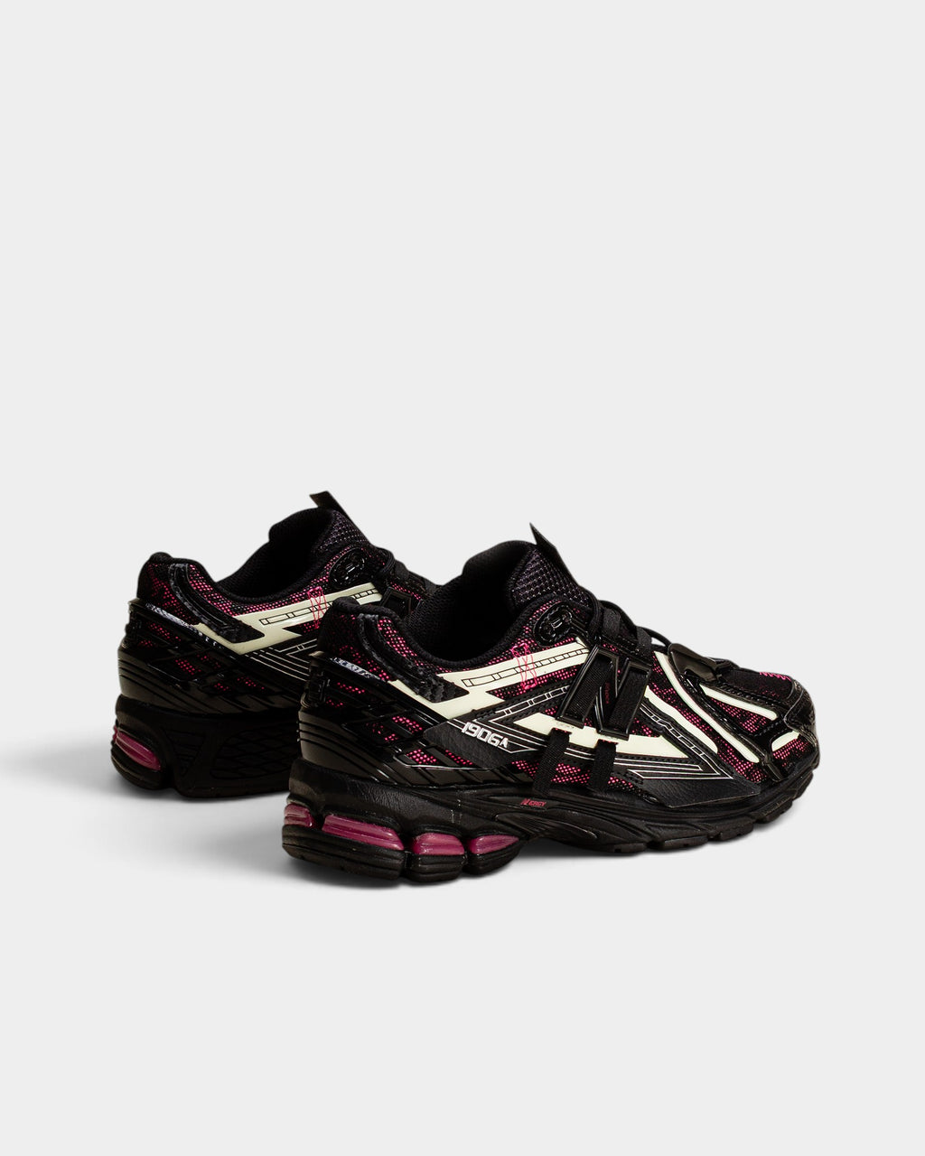 Lockwood Avenue New Balance 1906A sneakers in black with pink accents and glow-in-the-dark mesh running shoe details.