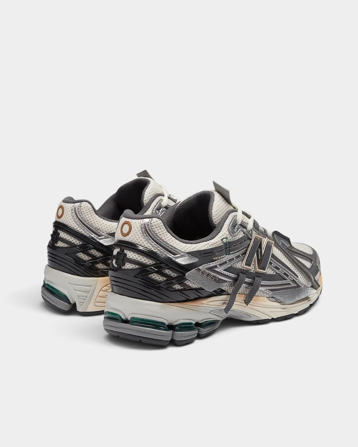 Lockwood Avenue New Balance 1906A sneakers in white mesh with silver, gold, and castlerock gray deconstructed overlays.