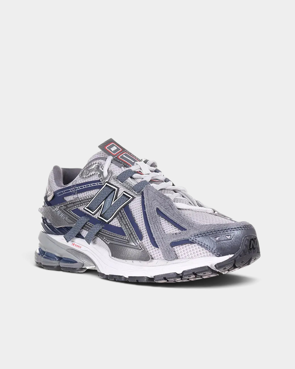 Lockwood Avenue New Balance 1906A sneakers in graphite gray mesh with blue synthetic overlays and N-ergy cushioning.