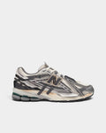 Lockwood Avenue New Balance 1906A sneaker in white mesh with silver, gold, and gray deconstructed metallic overlays.