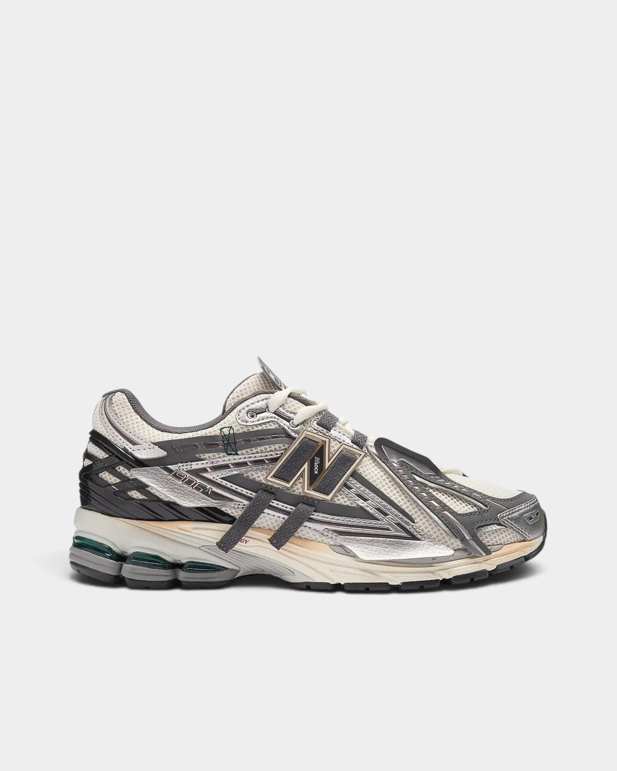 Lockwood Avenue New Balance 1906A sneaker in white mesh with silver, gold, and gray deconstructed metallic overlays.