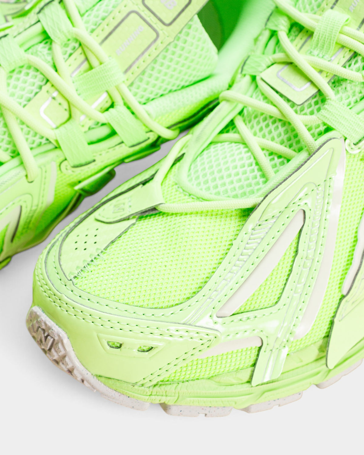 Lockwood Avenue New Balance 1906A sneakers in vibrant mint green mesh and metallic overlays with detailed lacing.