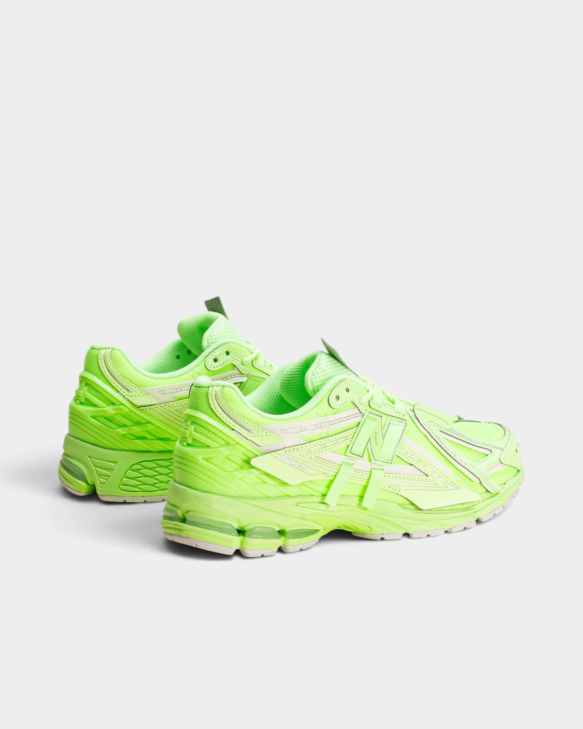 Lockwood Avenue New Balance 1906A sneakers in vibrant neon green with mesh upper, metallic overlays, and chunky sole.