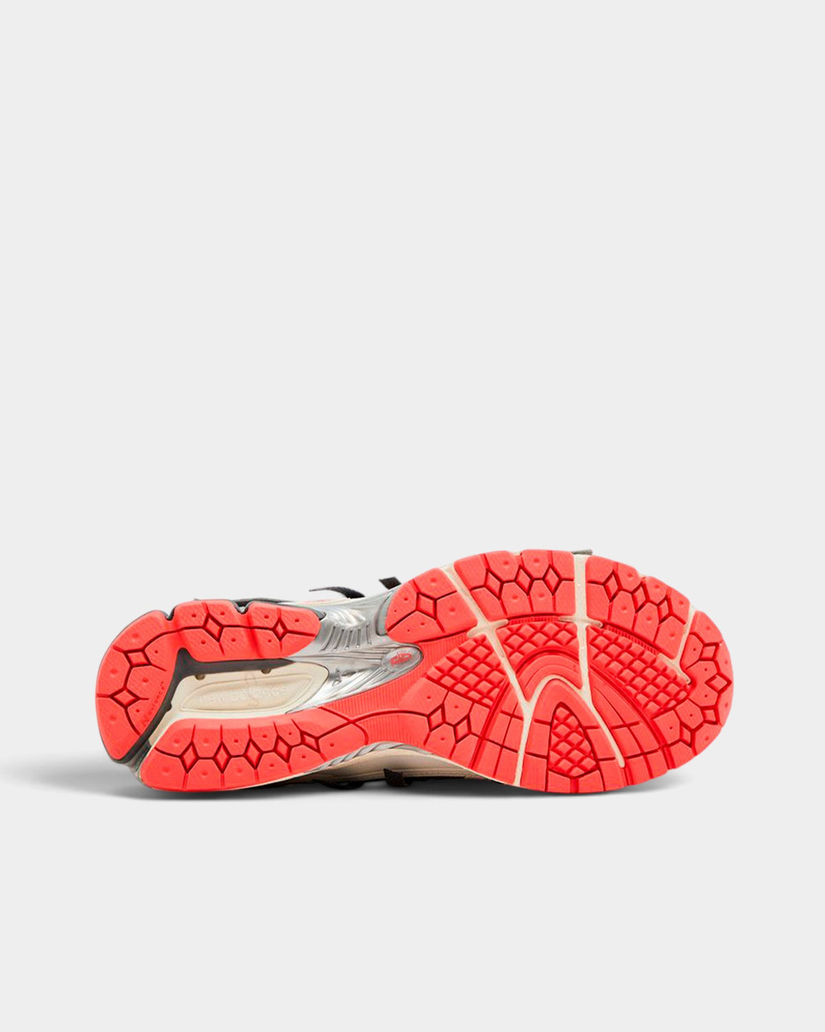 Lockwood Avenue New Balance 1906A sneaker showing the bright orange N-ergy rubber outsole and textured tread pattern