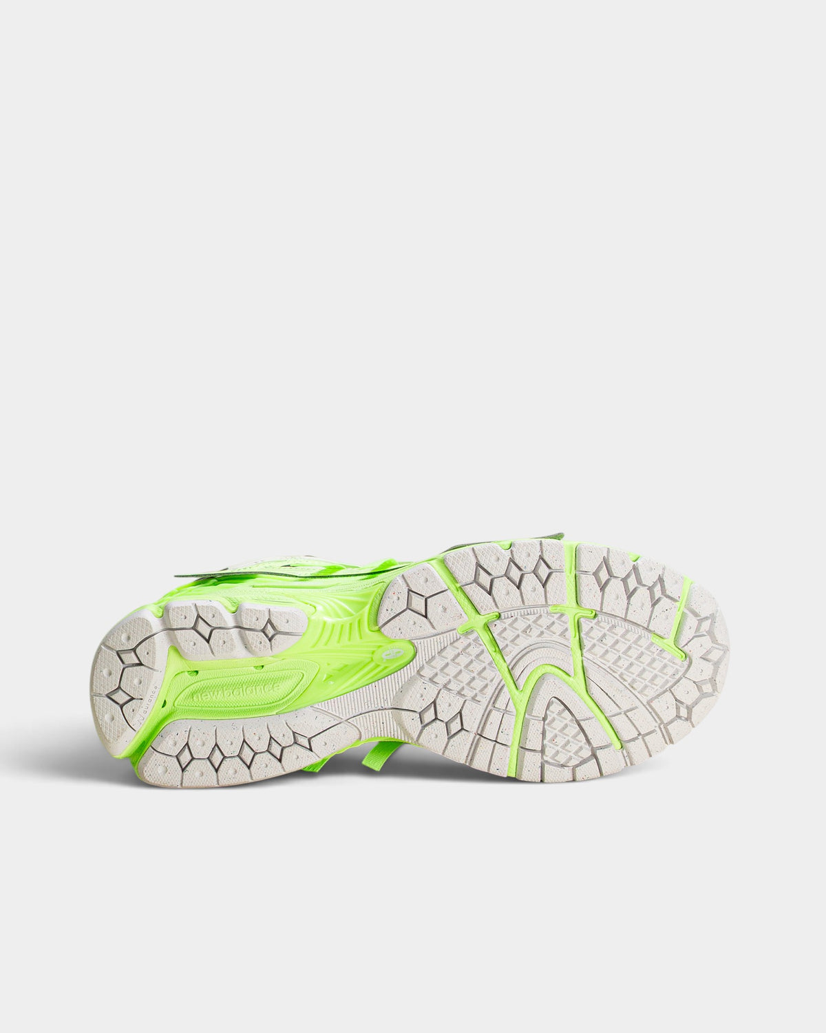 Lockwood Avenue New Balance 1906A sneaker showing the white and mint green textured rubber outsole and heel pods