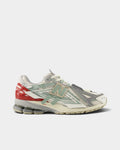 Lockwood Avenue New Balance 1906A sneaker in off-white mesh with sage green overlays and a red TPU heel counter.
