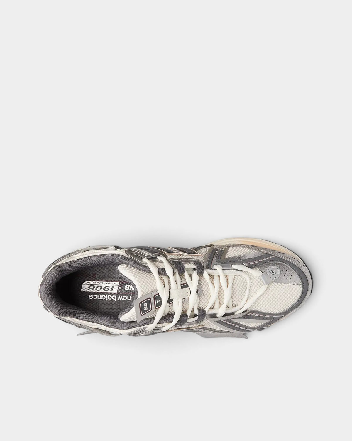 Lockwood Avenue New Balance 1906A sneakers in white mesh with silver, gold, and gray deconstructed layered overlays.