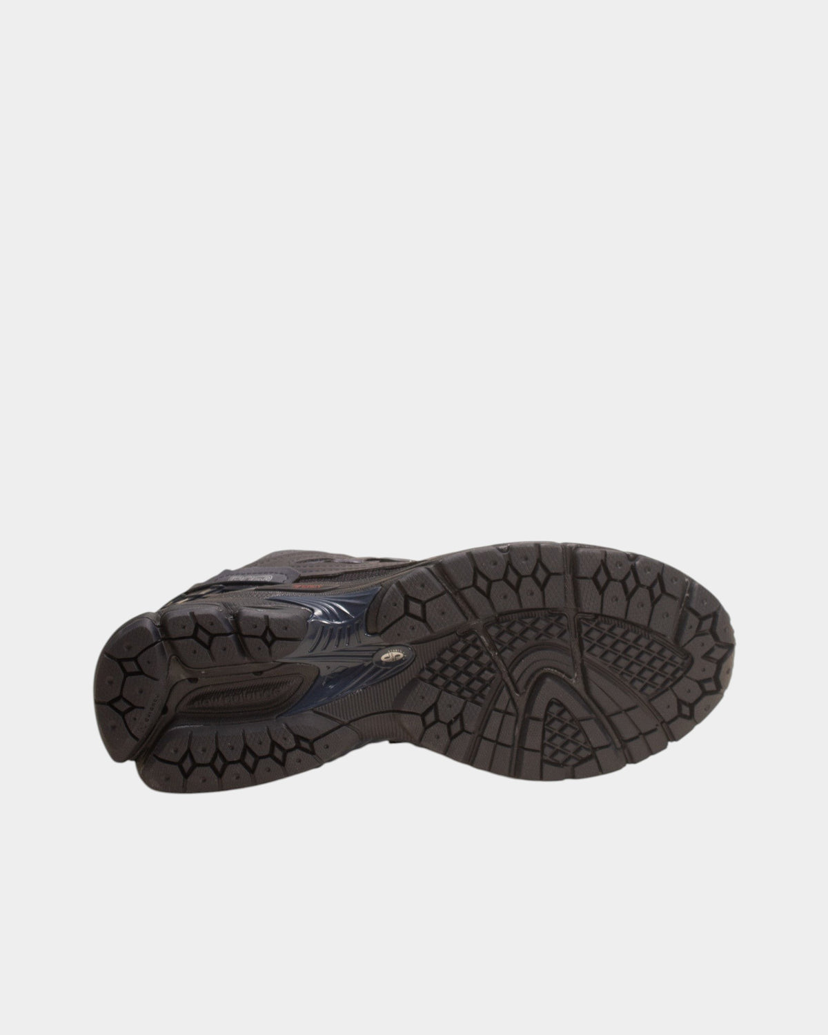 Lockwood Avenue New Balance 1906D sneaker showing the black rubber outsole with N-ergy and ABZORB cushioning technology