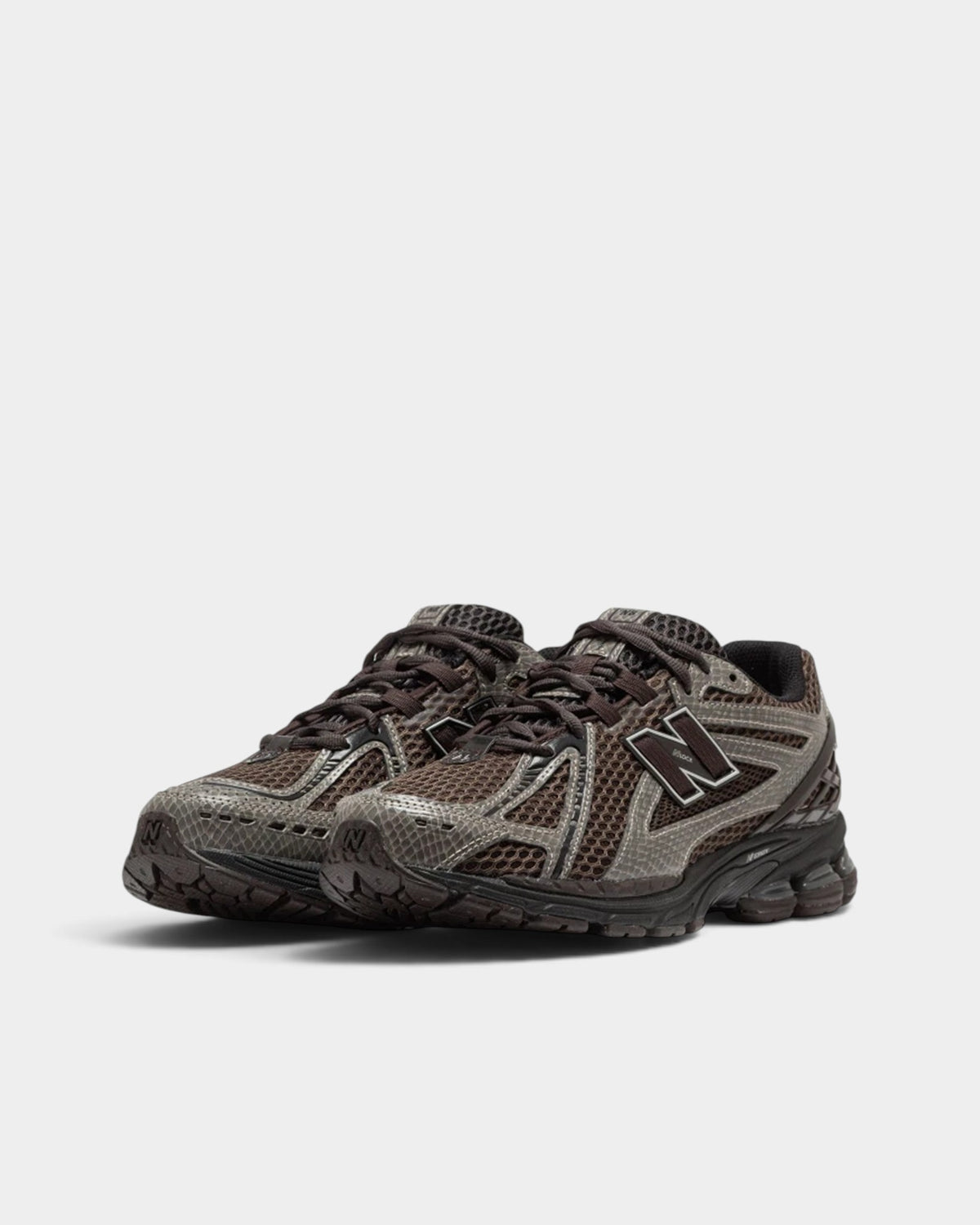 Lockwood Avenue New Balance 1906R sneakers in brown with snakeskin-print synthetic overlays and open mesh base.