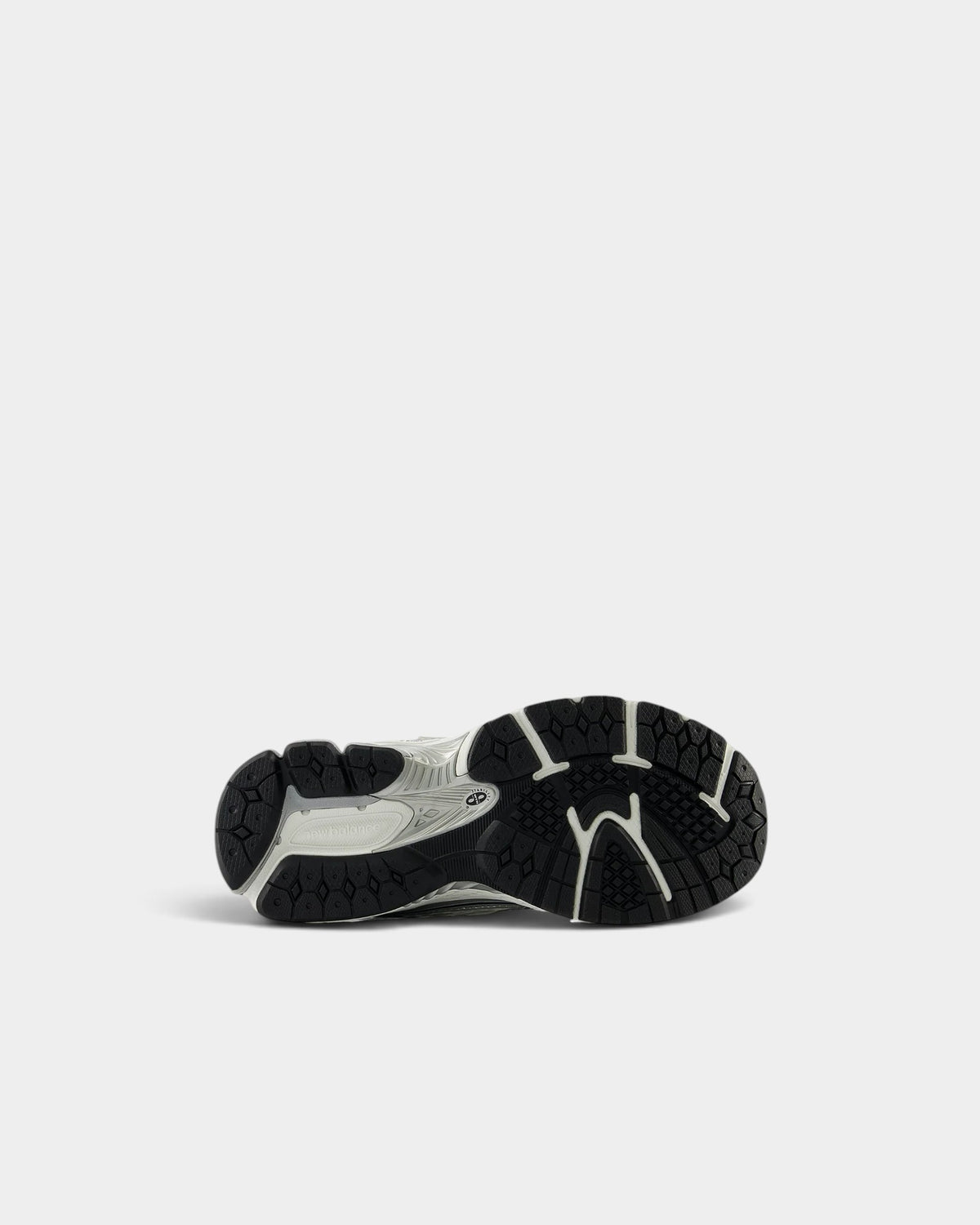 Lockwood Avenue New Balance 1906R GS sneakers showing the black and silver rubber outsole tread pattern