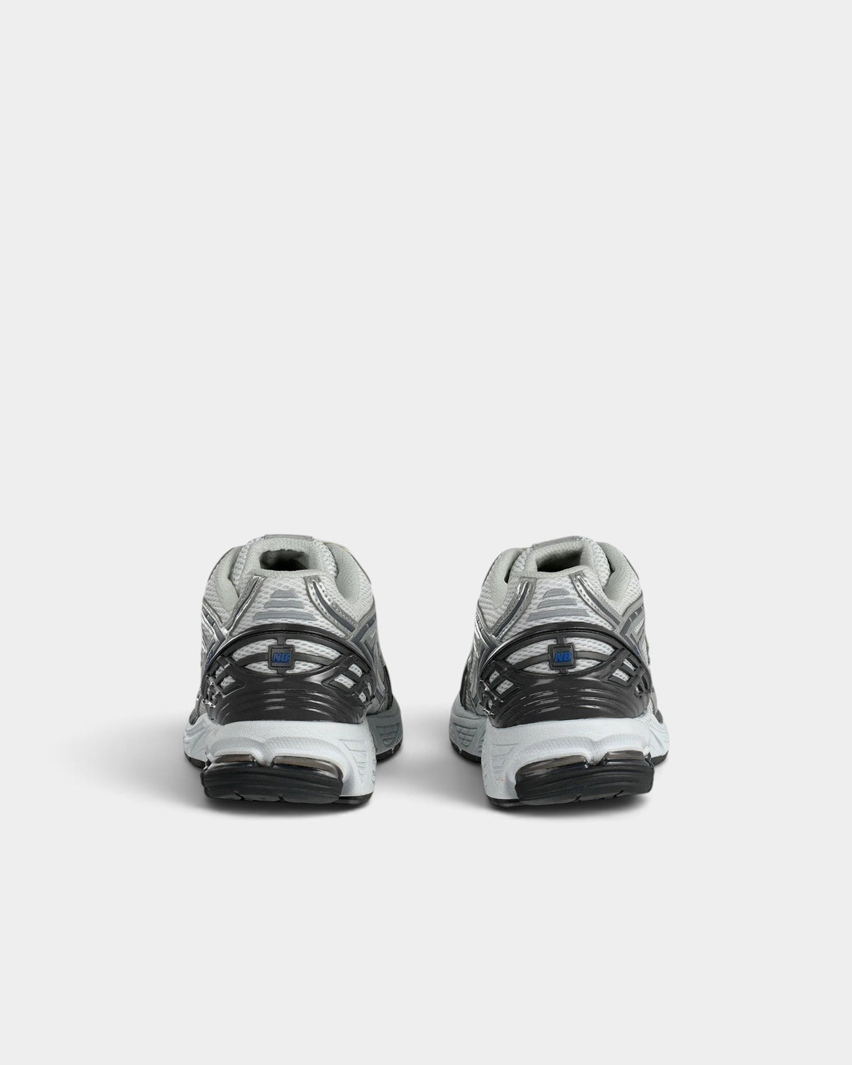 Lockwood Avenue New Balance 1906R performance running shoes in grey and metallic silver, rear view showing heel detail.