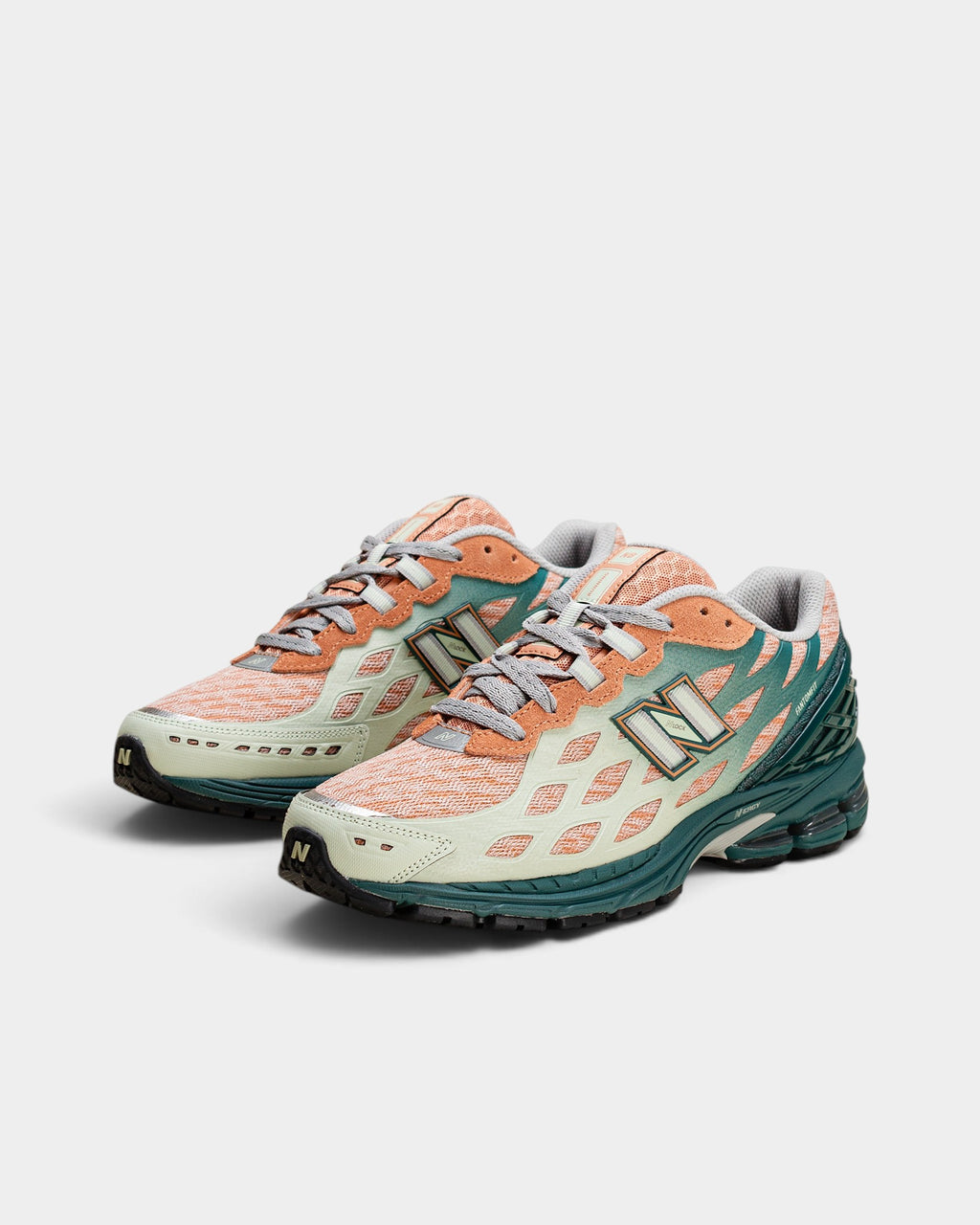 Lockwood Avenue New Balance 1906W sneakers in spruce, light sparrow, and mint with webbed synthetic overlays.