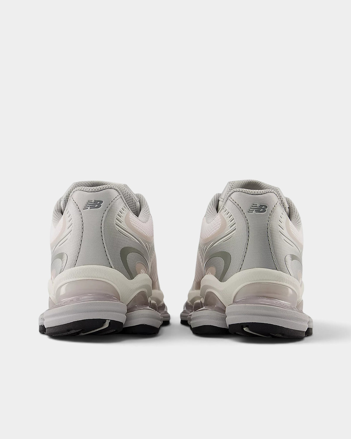 Lockwood Avenue New Balance 2000 running shoes in white and gray with pink salt accents, rear view showing ABZORB sole