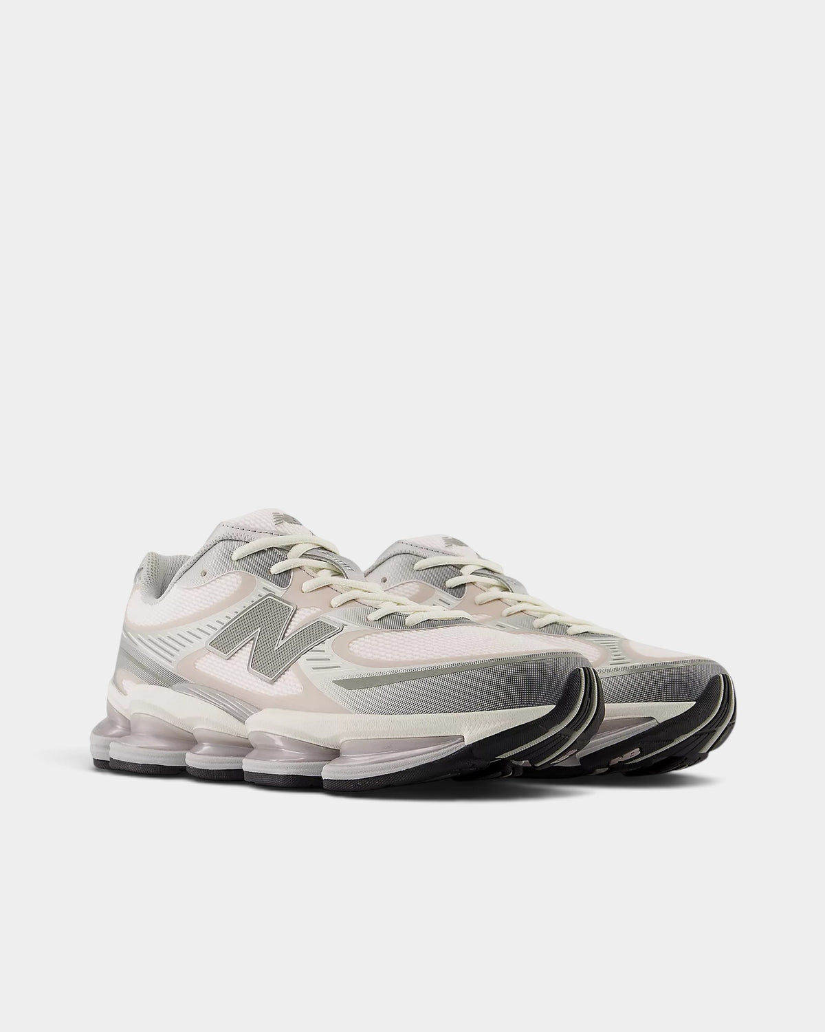 Lockwood Avenue New Balance 2000 sneakers in white mesh with gray, silver overlays and pink salt piping details.