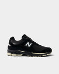 Lockwood Avenue New Balance 2002R sneakers in black and timberwolf gray with premium suede and mesh construction.