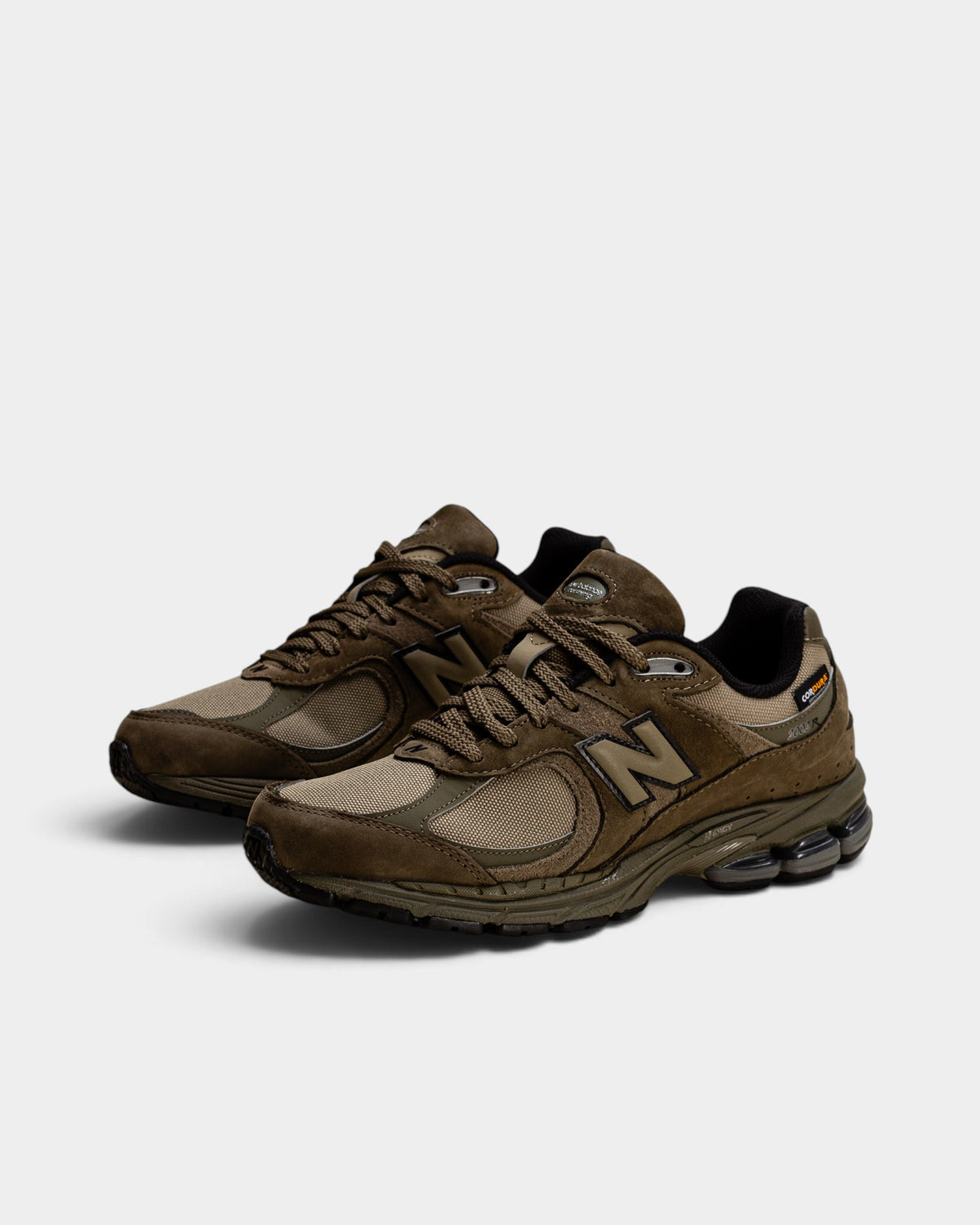 Lockwood Avenue New Balance 2002R olive Cordura sneakers with suede overlays and durable mesh for weather resistance