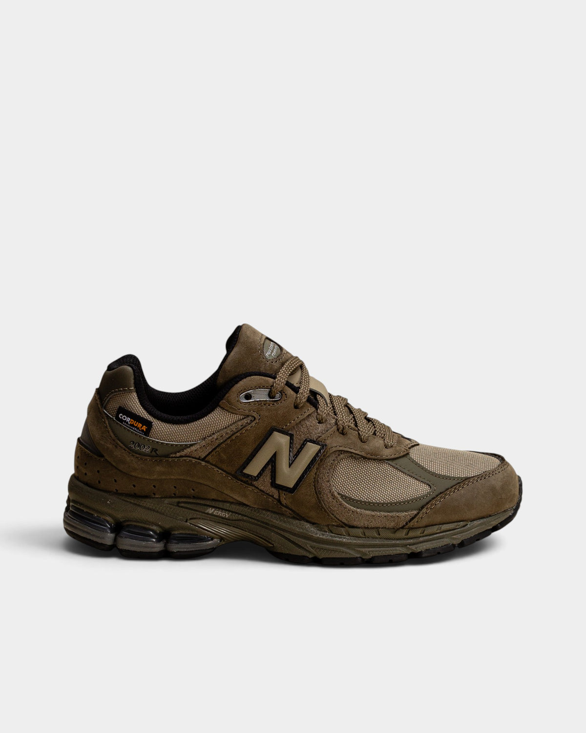Lockwood Avenue New Balance 2002R olive Cordura sneakers with suede and mesh panels and N-ergy shock-absorbing sole.