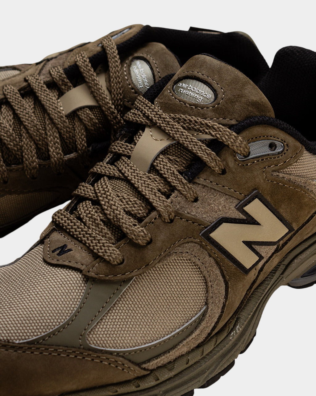 Lockwood Avenue New Balance 2002R olive Cordura sneakers with suede and mesh overlays and durable running silhouette