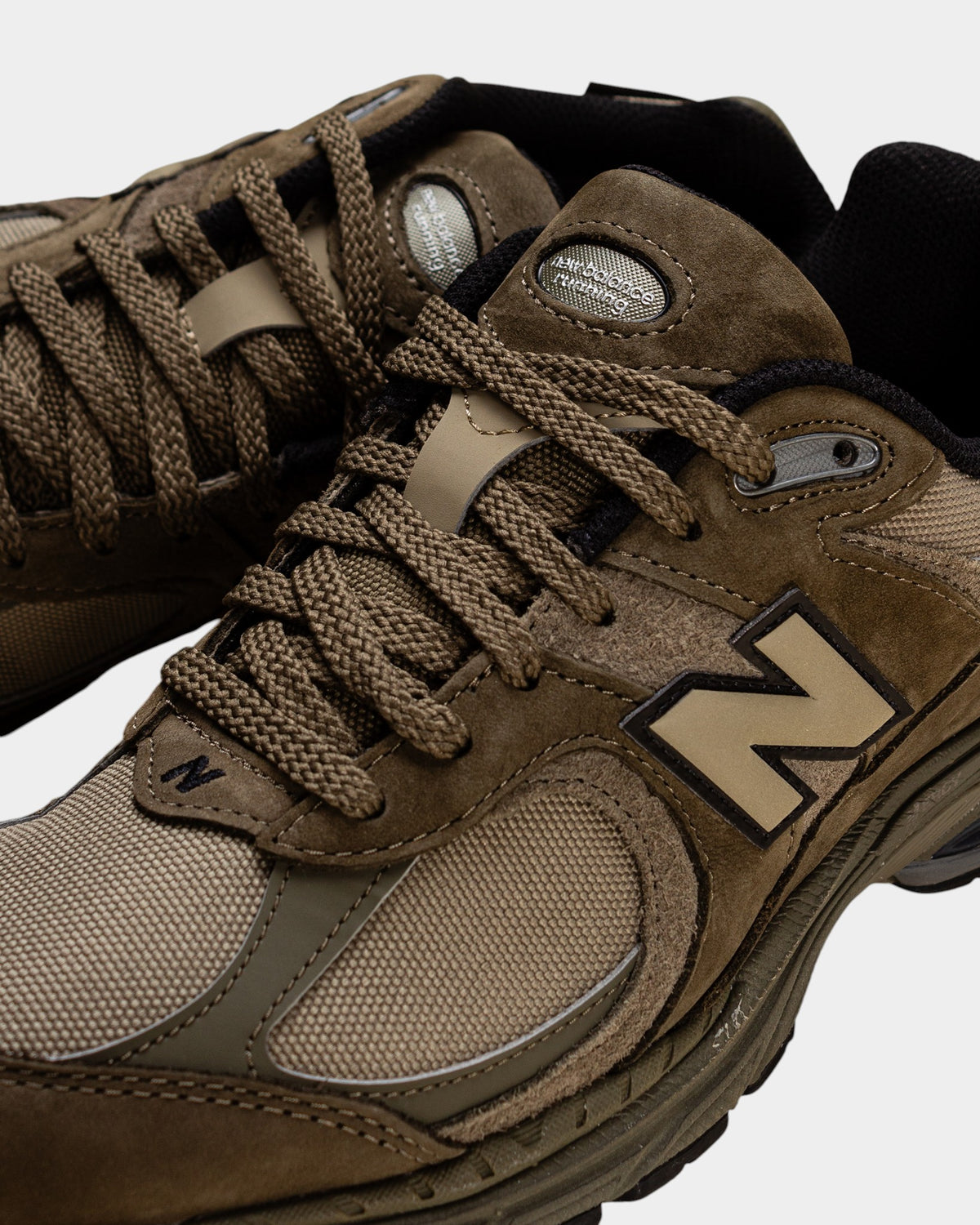 Lockwood Avenue New Balance 2002R olive Cordura sneakers with suede and mesh overlays and durable running silhouette