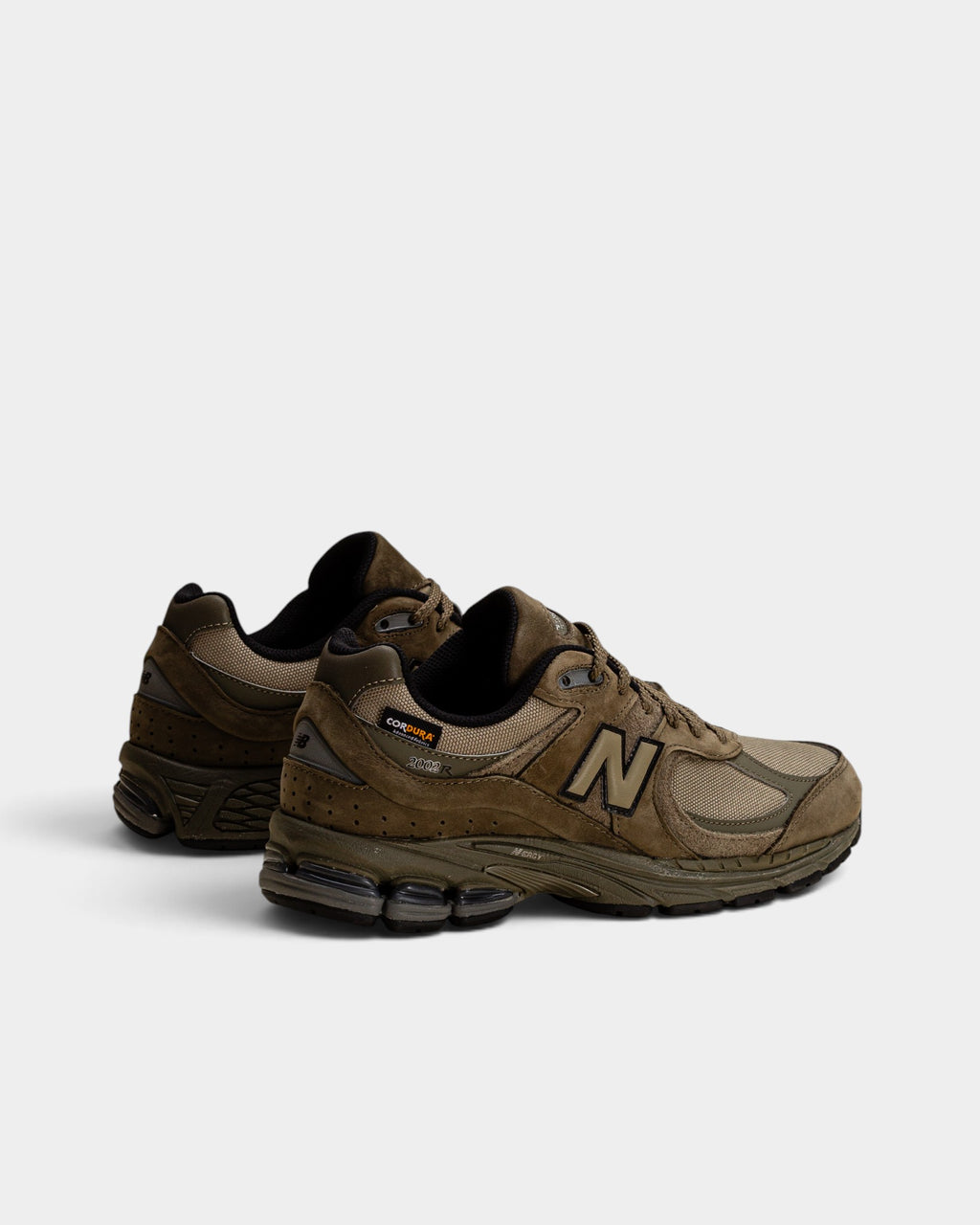Lockwood Avenue New Balance 2002R Cordura sneakers in olive green with suede overlays and durable mesh construction.