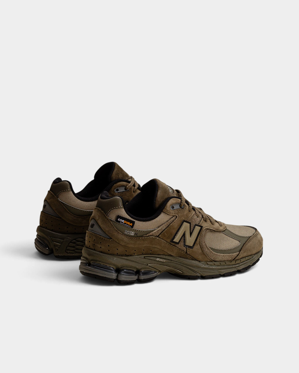 Lockwood Avenue New Balance 2002R Cordura sneakers in olive green with suede overlays and durable mesh construction.