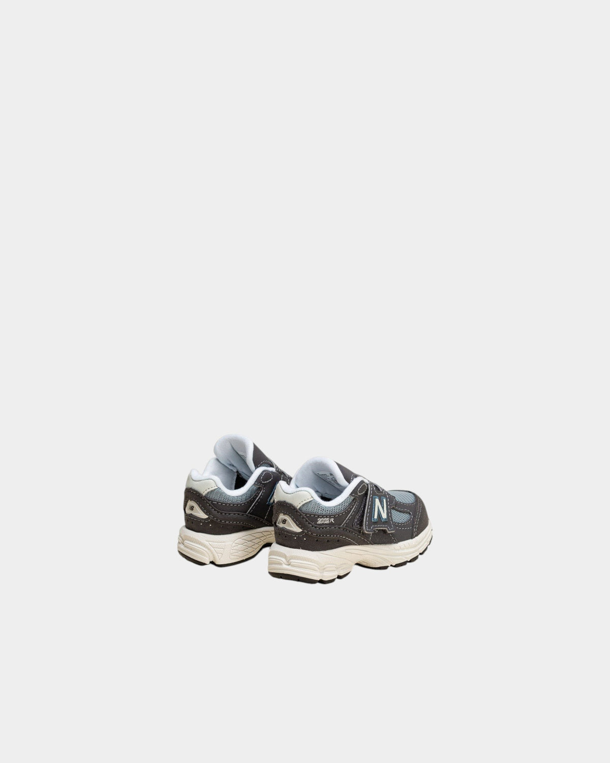 Lockwood Avenue New Balance 2002R toddler shoes in magnet and lead gray with suede overlays and hook-and-loop strap.