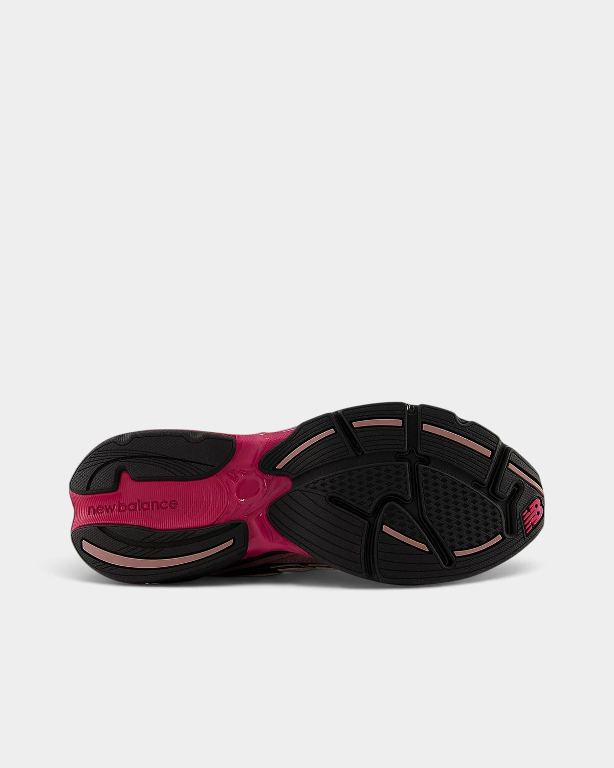 Lockwood Avenue New Balance 2010 sneaker showing the black rubber outsole with pink ABZORB cushioning pods