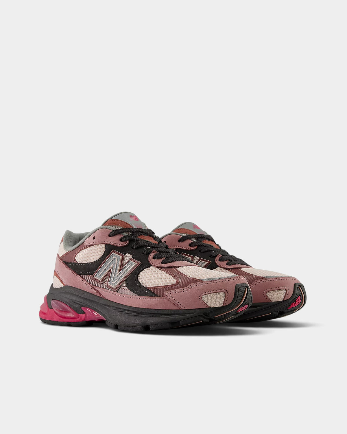 Lockwood Avenue New Balance 2010 sneakers in rosewood, violet, and pink with mesh, nubuck, and synthetic overlays.