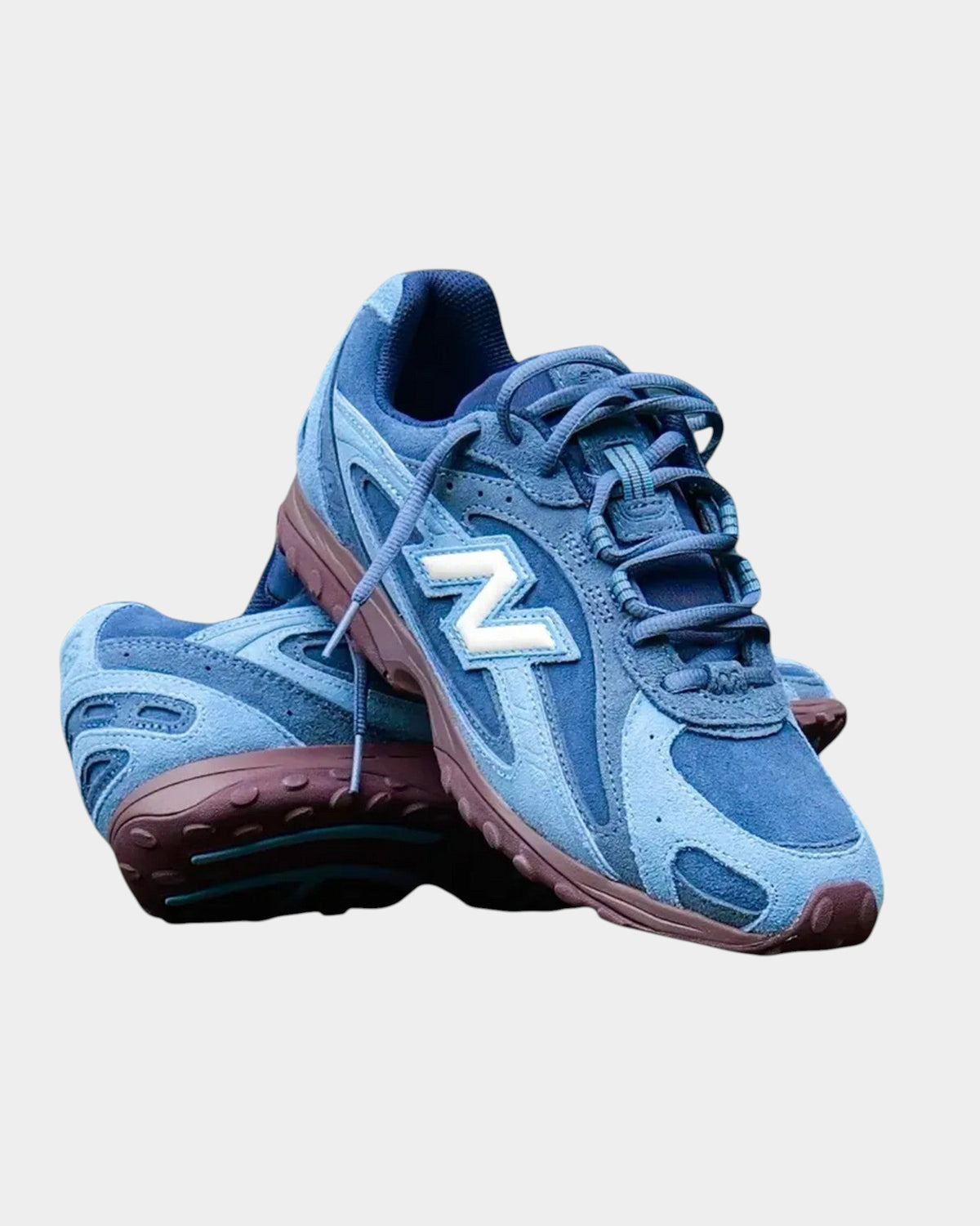 Lockwood Avenue New Balance 204 sneakers in blue suede and mesh with a plum-brown outsole and white N logo