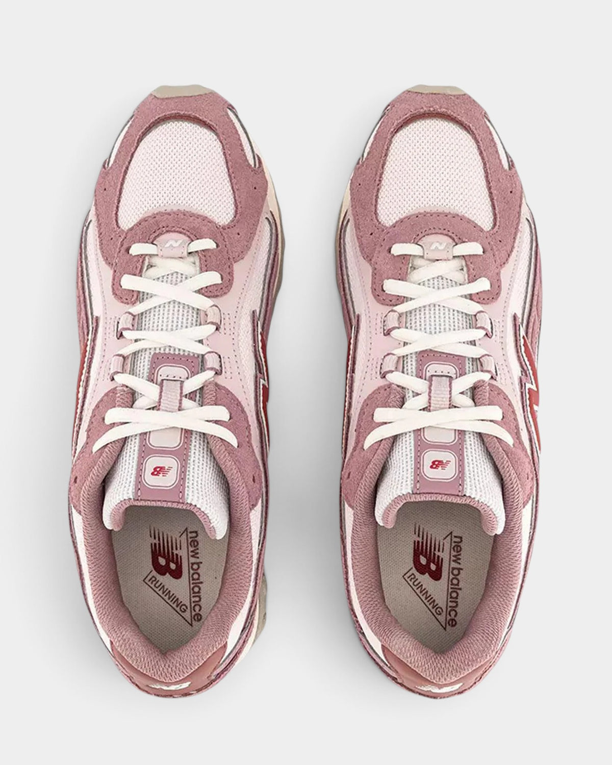 Lockwood Avenue New Balance 204L sneakers in rosewood suede and mesh with pink, white, and red accents, top view.