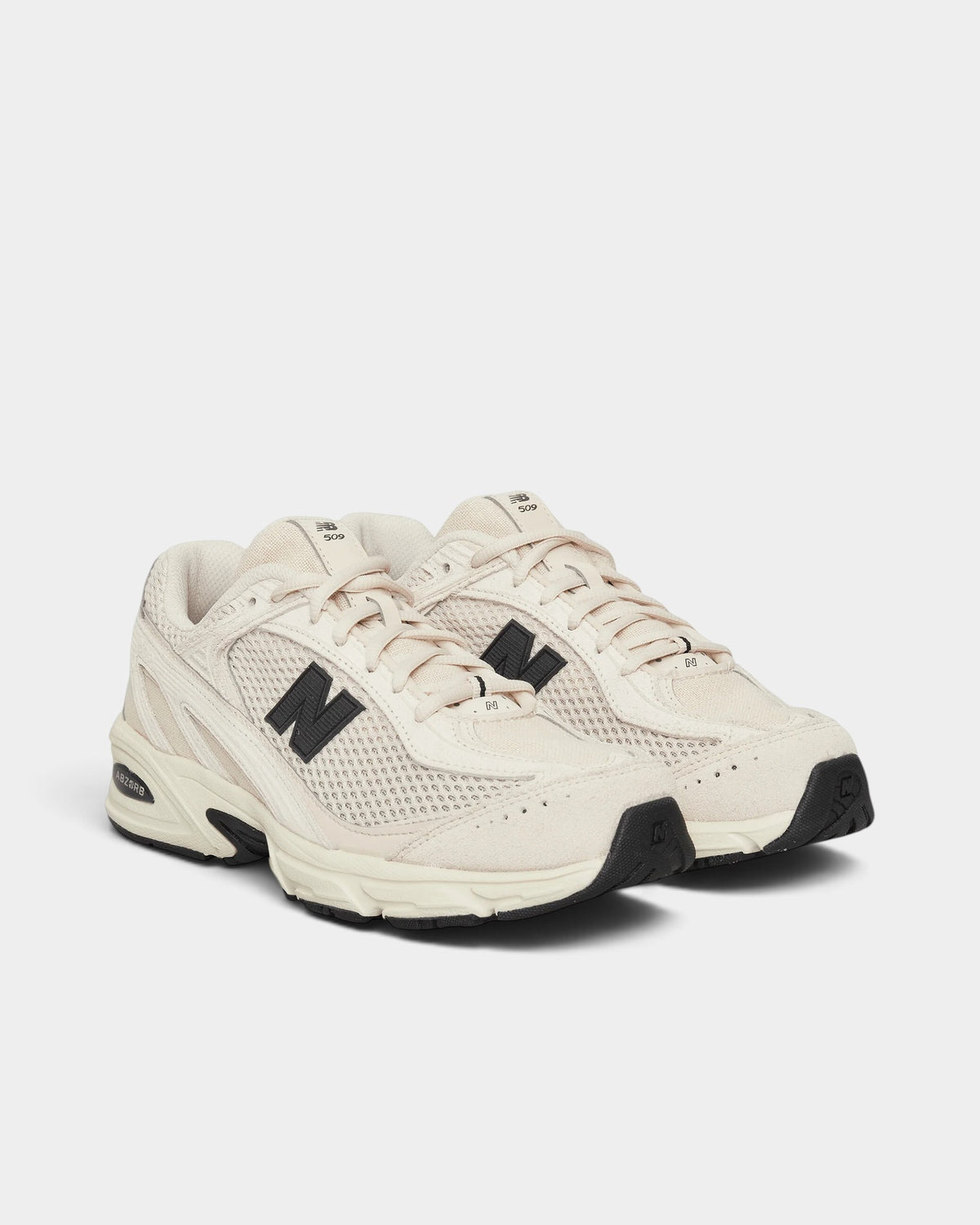 Lockwood Avenue New Balance 509 sneakers in bisque mesh and leather with black accents and ABZORB midsole cushioning.