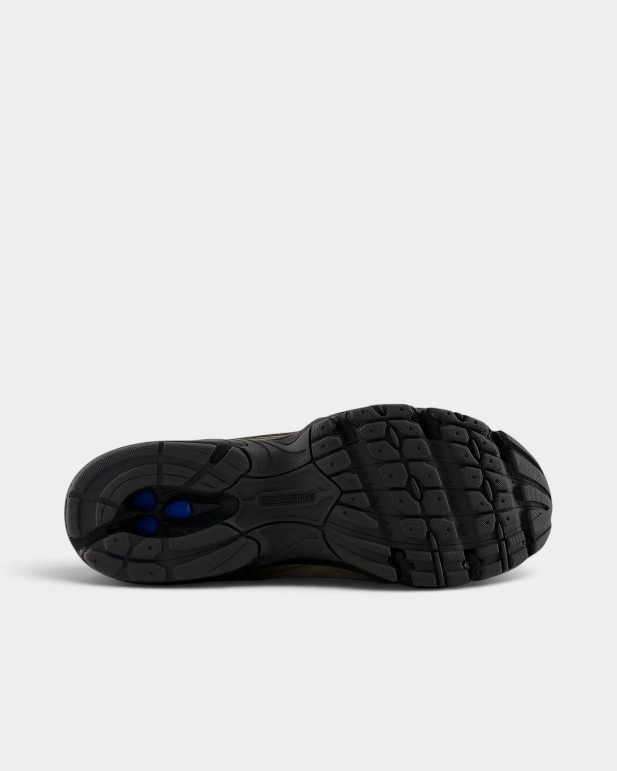 Lockwood Avenue New Balance 509 sneaker showing the black rubber outsole with blue cushioning detail