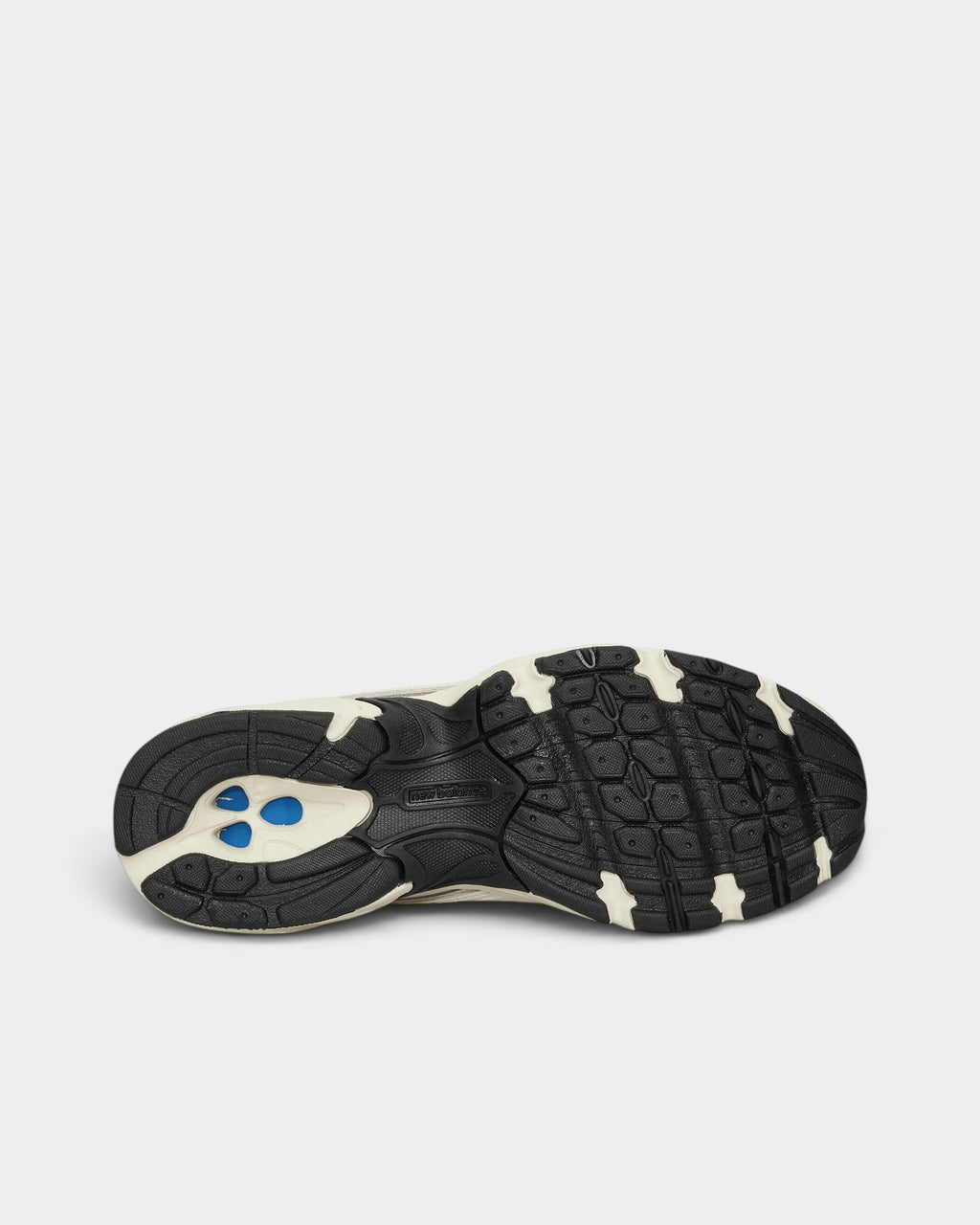 Lockwood Avenue New Balance 509 sneaker rubber outsole in black and bisque with blue cushioning details
