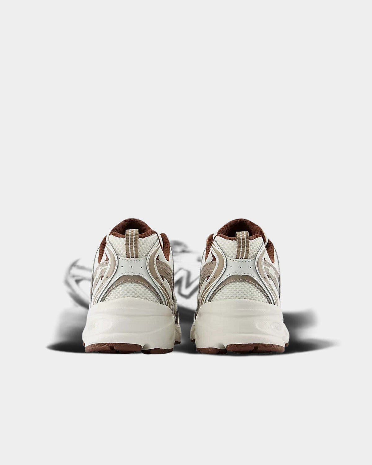 Lockwood Avenue New Balance 530 sneakers in white and brown mesh with synthetic overlays, rear view