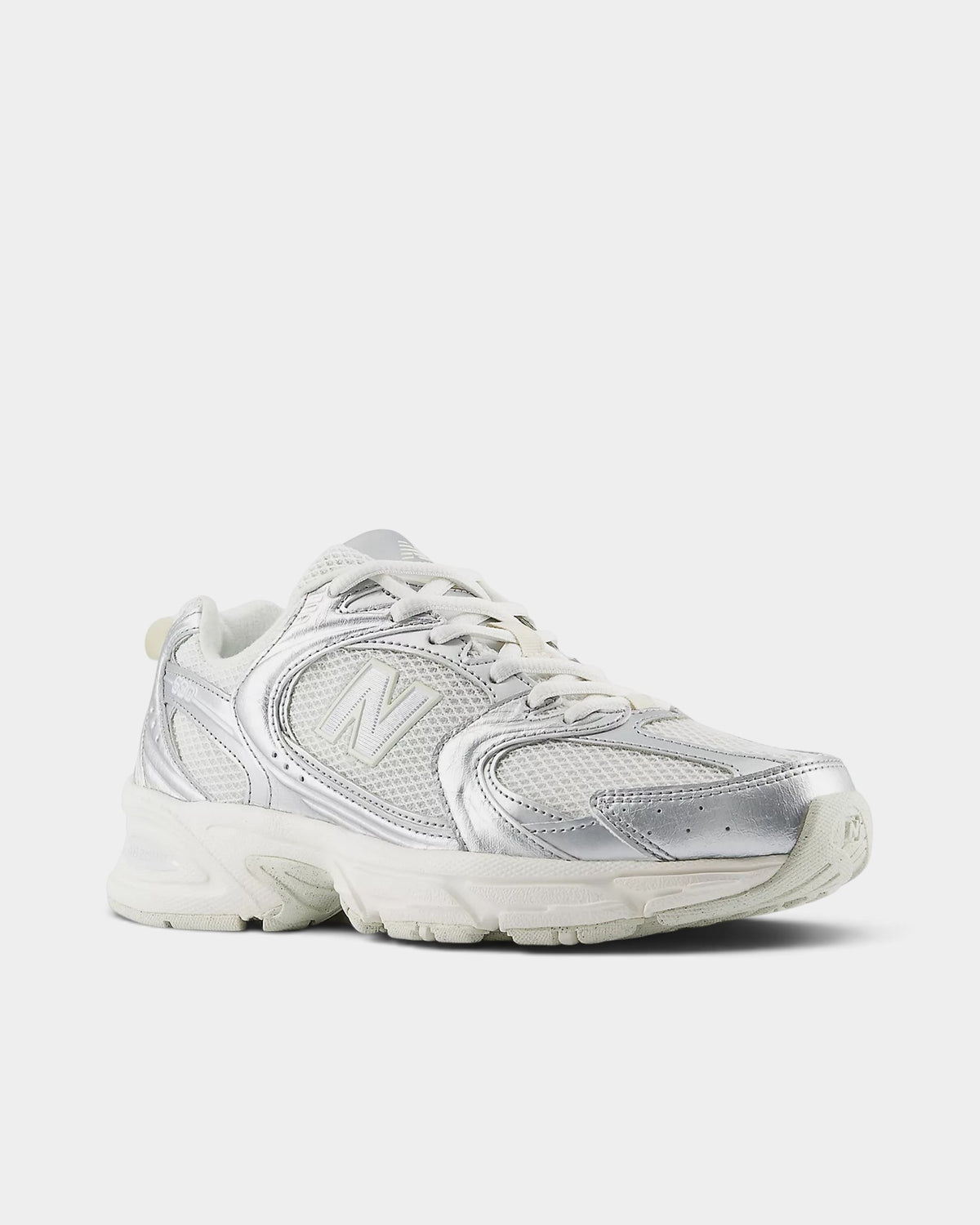 Lockwood Avenue New Balance 530 retro runner in white mesh with metallic silver overlays and reflective details.