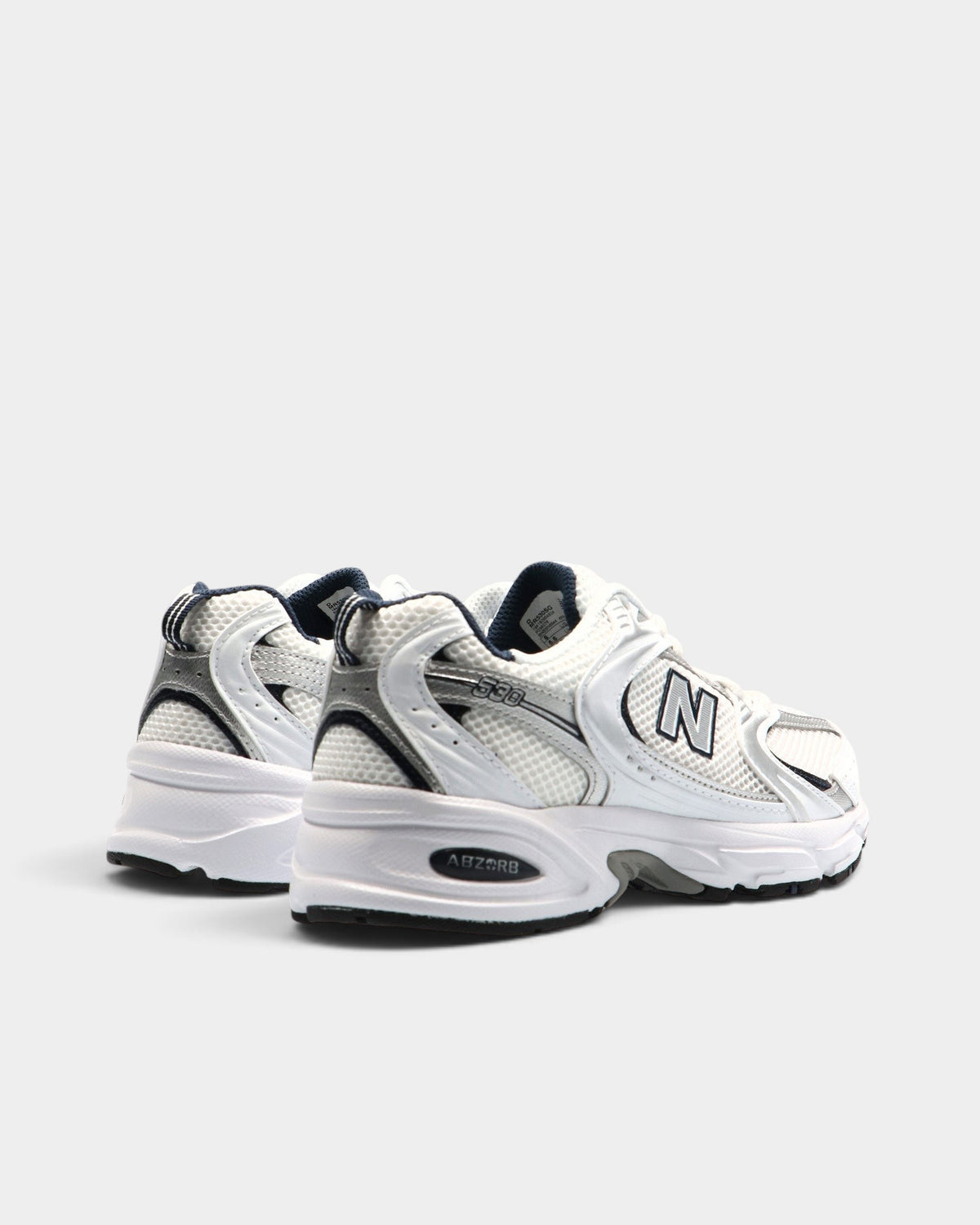 Lockwood Avenue New Balance 530 retro running shoes in white mesh with natural indigo accents and ABZORB midsole.
