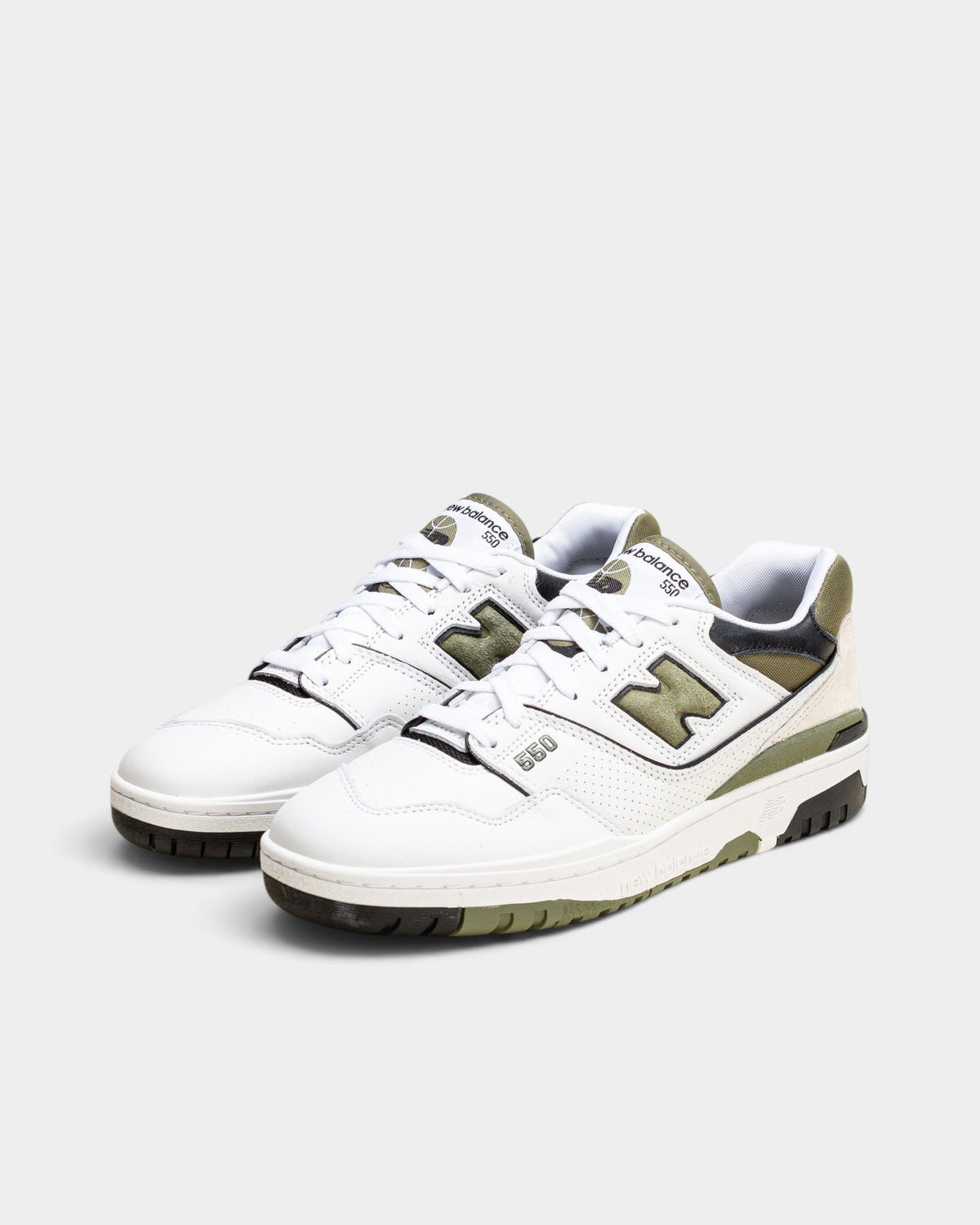 Lockwood Avenue New Balance 550 low-top sneakers in white leather with dark olivine accents and black N logo.